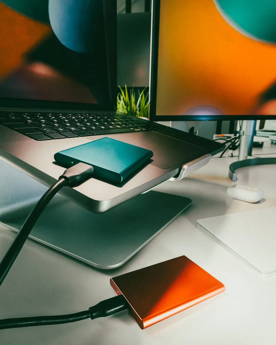 Laptop and external drives arranged for data backup