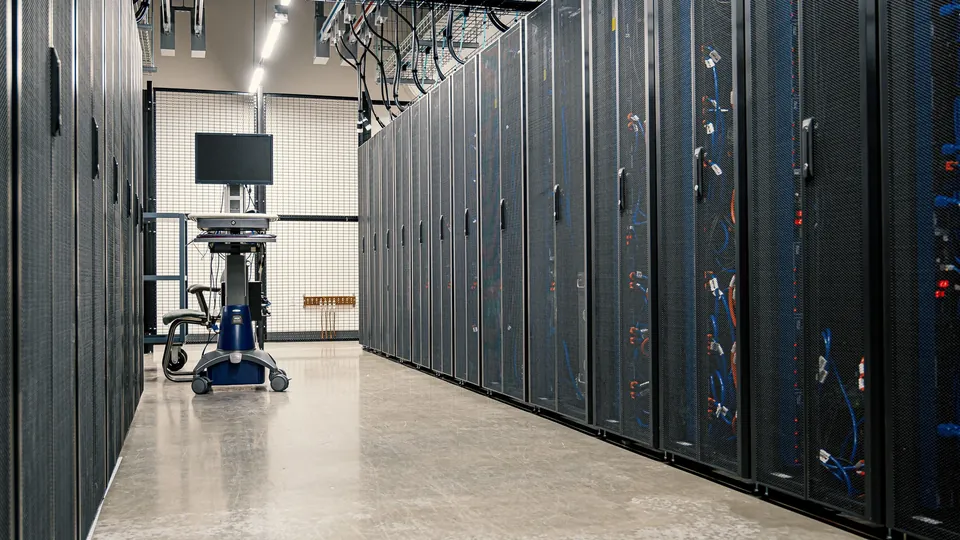 Aisle between rows of server cabinets in a data centre